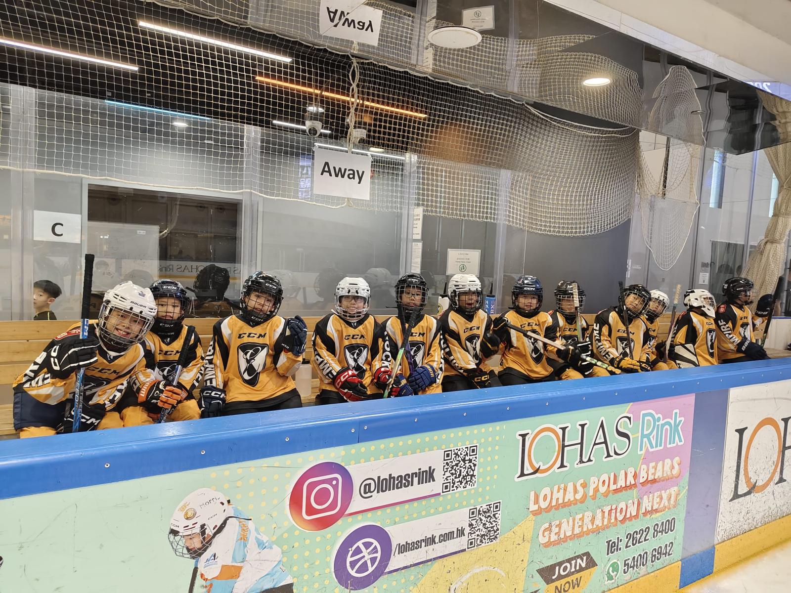 Empire players lined up on the bench before a game