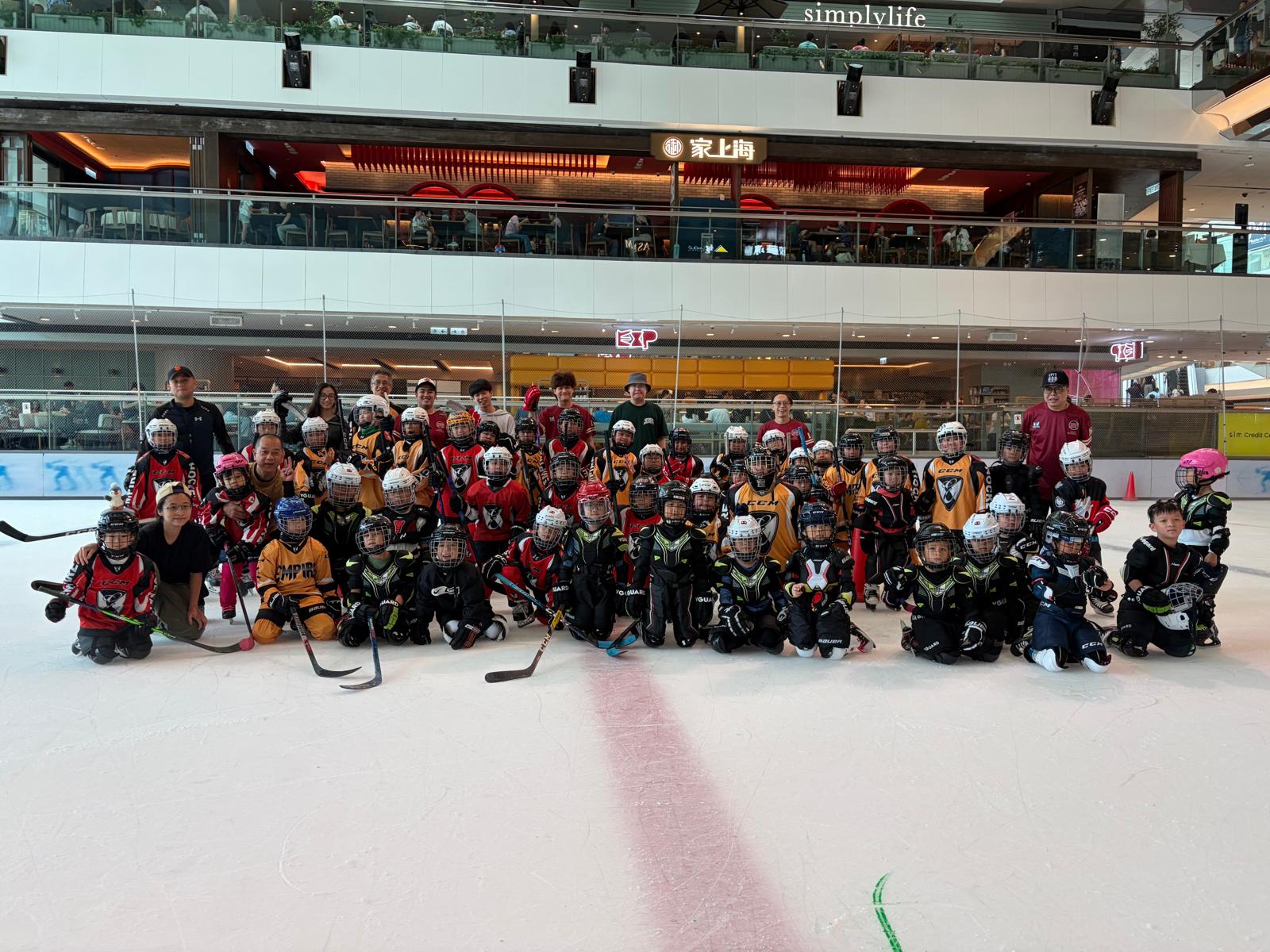The full Empire squad and coaches gathered on the rink for a group photo