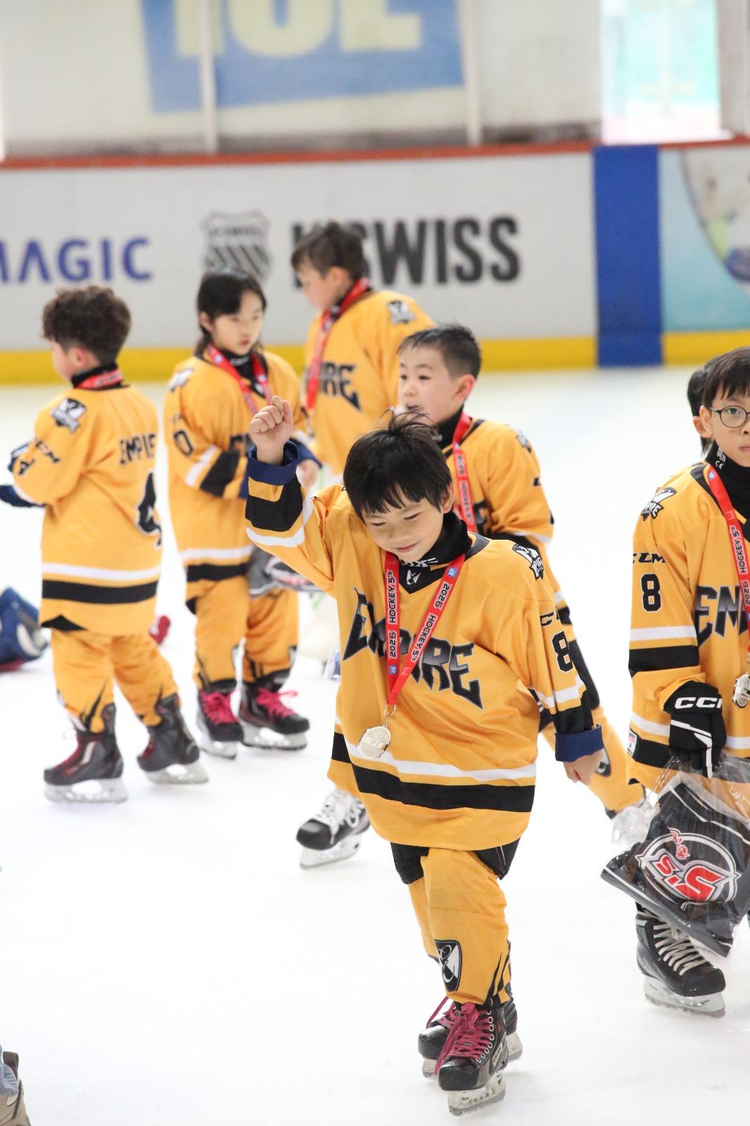 Empire players leaving the ice with their medals