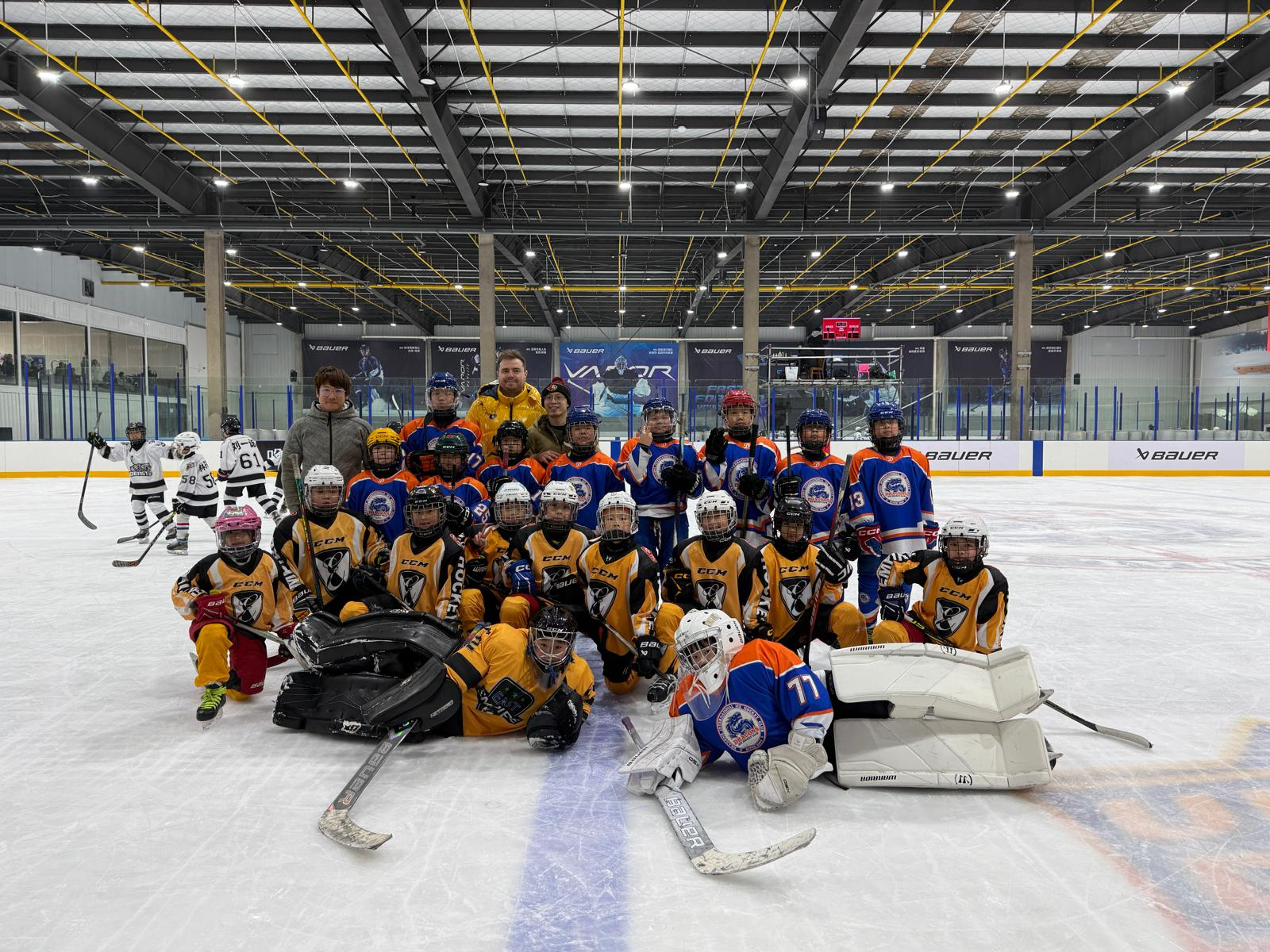 Empire Glory players and coaches on the ice at the China Youth Ice Hockey League in Wuhan